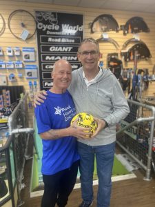 Kevin and Alan Knight holding a football