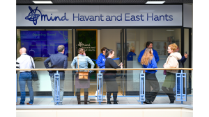 Group of people talking outside the Mental Health Hub 